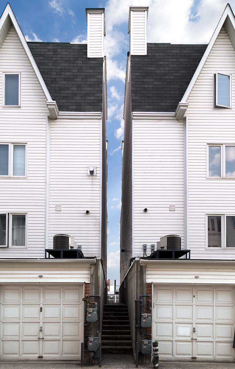 20150307. The space between houses offers a break in the banalit