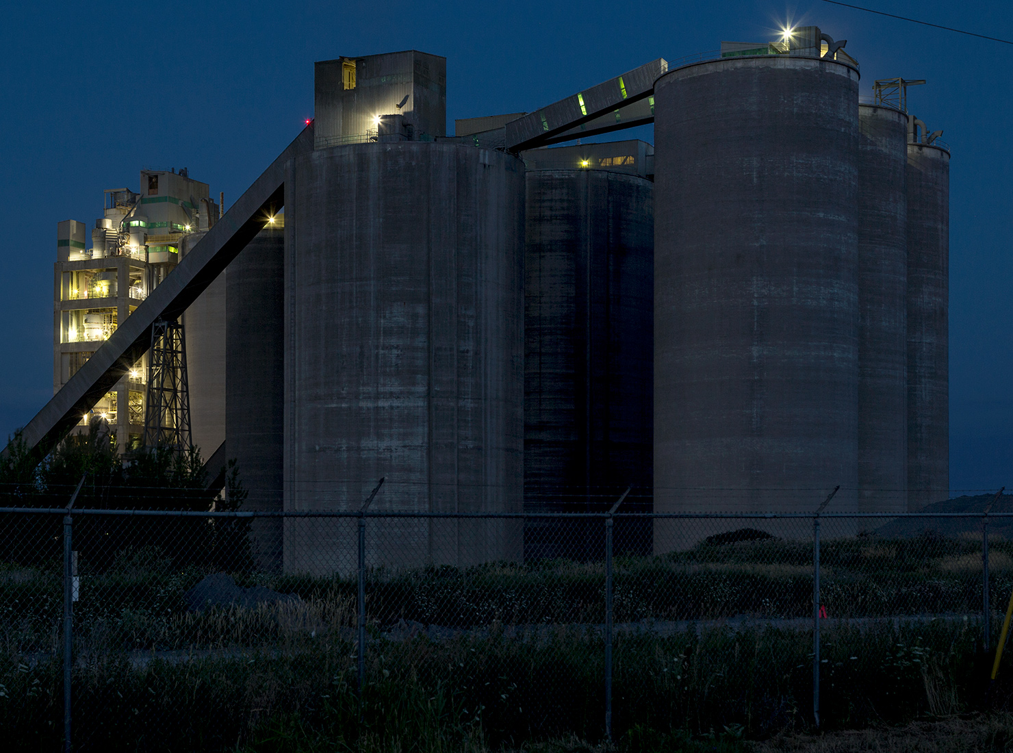 20160724. The silos of St. Marys Cement at dusk.