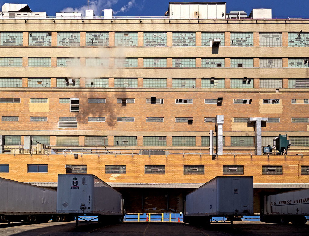 20140421-trailers-sit-in-the-shade-below-the-general-mills-plant-in