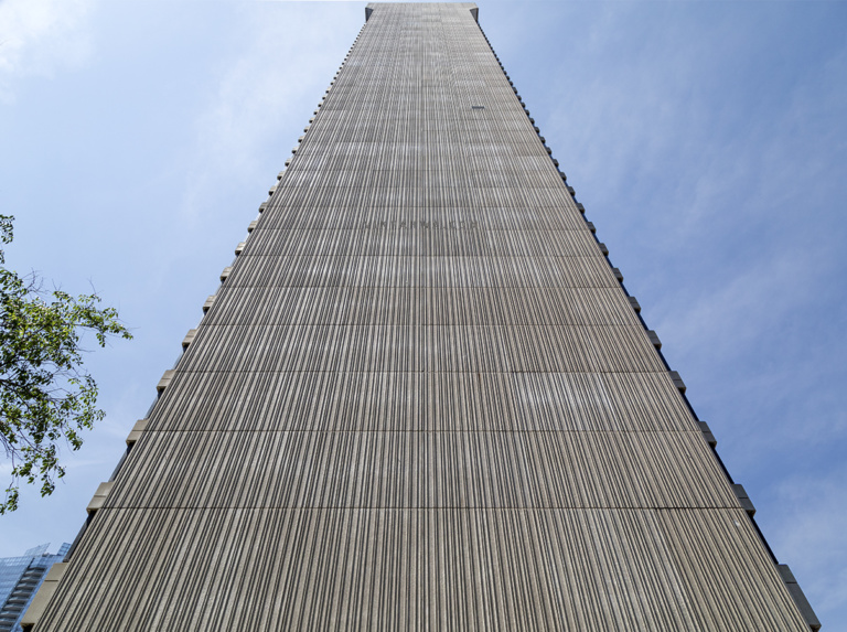 20180601. The windowless west precast corduroy concrete facade of the ...